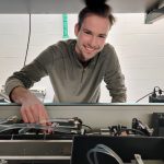 researcher adjusting laser in lab